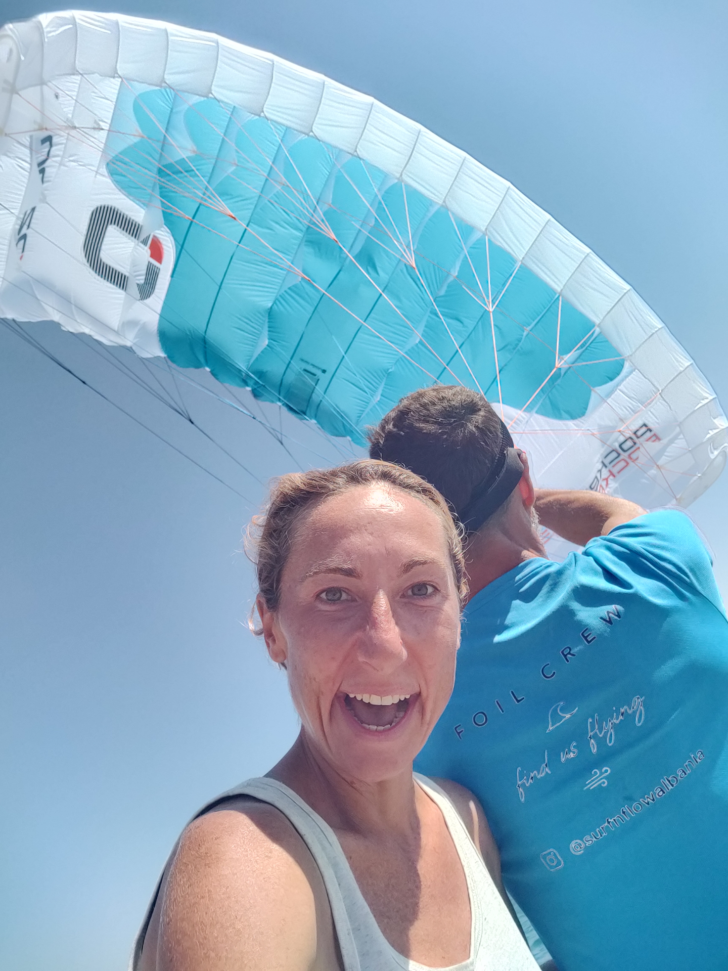Katy and Ferdi launching a parawing on the Sarandë shoreline