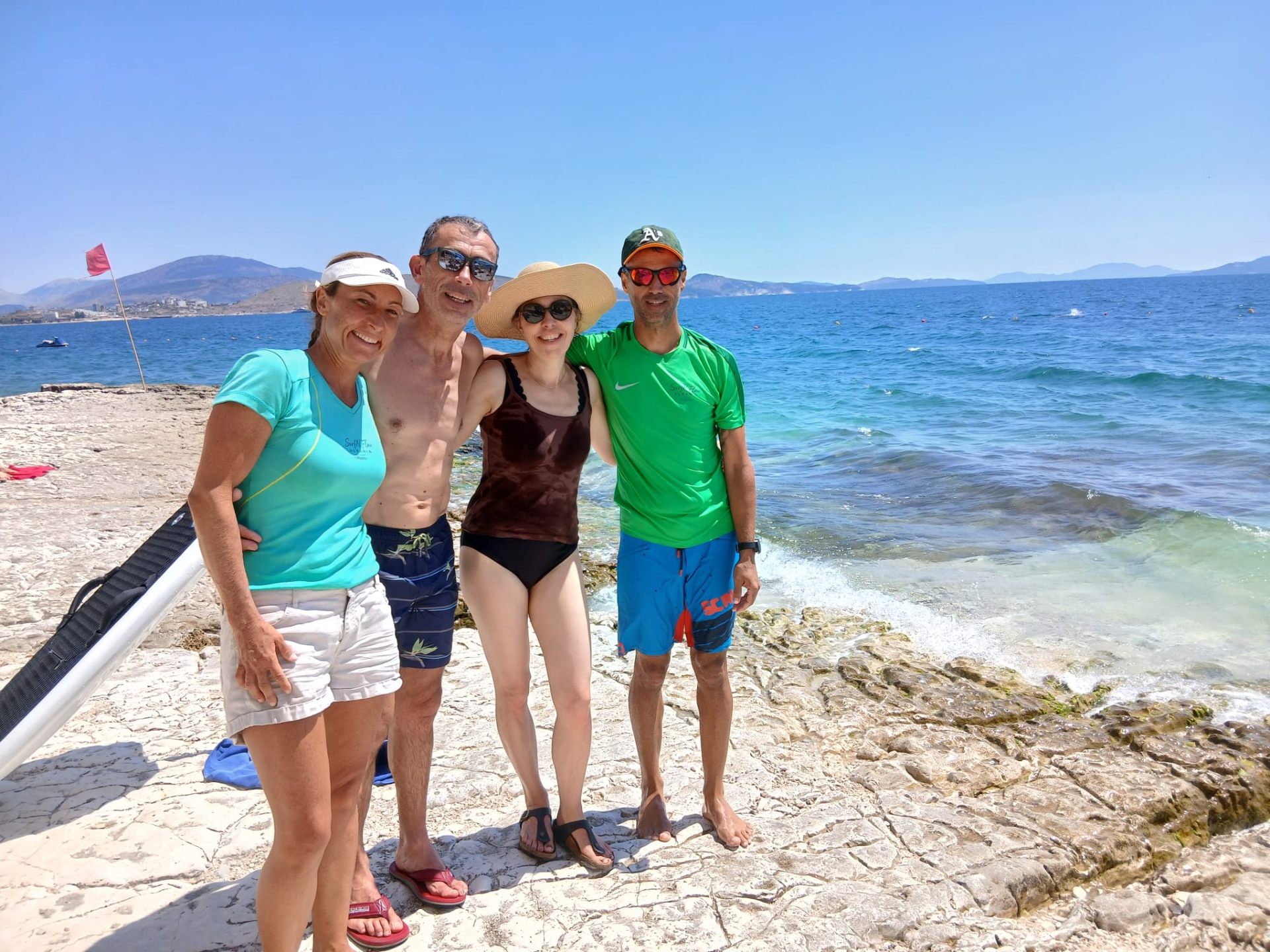 French couple with SurfN'Flow founders Ferdi and Katy on the Sarandë shoreline